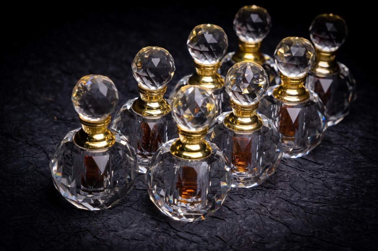 Pure oud essential oil presented in luxury frosted glass packaging for niche perfumery applications