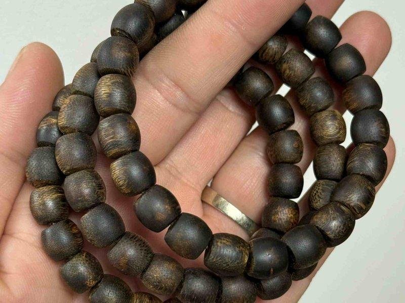 Round-bead multi-wrap agarwood bracelet, a long strand whose cord needs regular checks