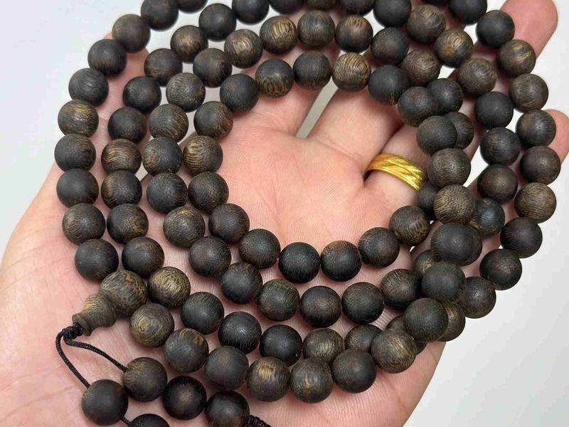 Agarwood bead bracelet of the kind Buddhist retailers stock as wrist malas and prayer beads
