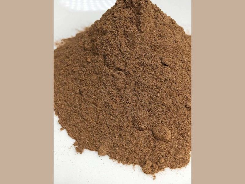 Fine agarwood powder of the kind blended with binder and pressed into oud incense cones and sticks