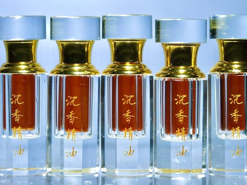 Diluted agarwood oil in a small bottle, measured by weight and ready for roll-on or attar use