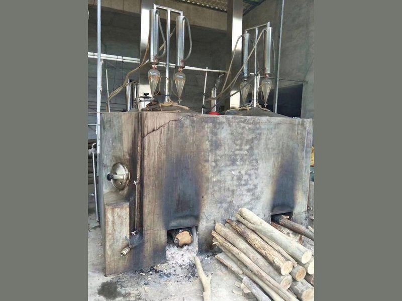 Traditional hydro-distillation setup used to produce oud oil, the stage where much of the oil's smell is set