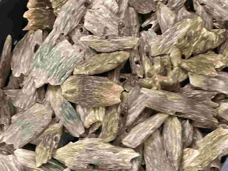 What is oud in solid form: resinated agarwood wood pieces of the kind burned as chips